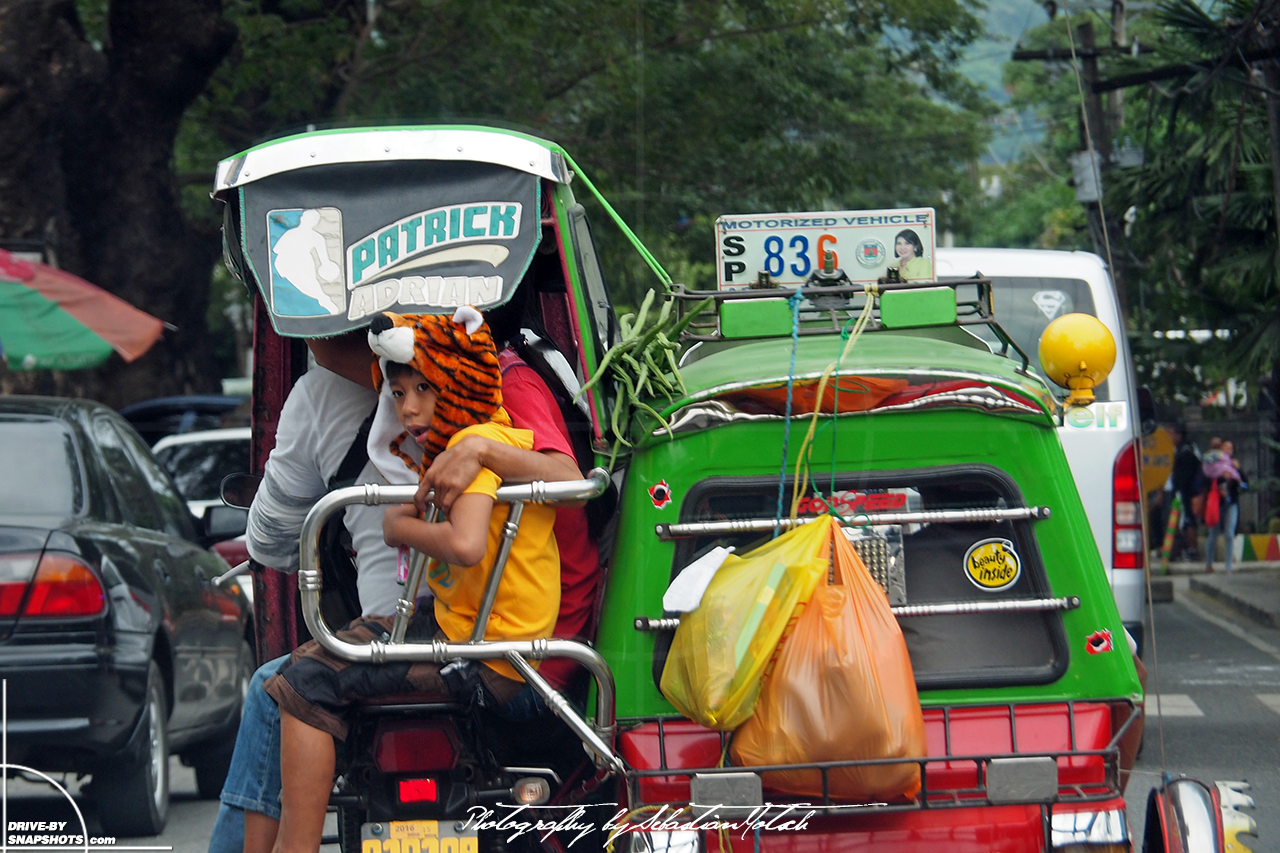 Boy with tiger cap riding tricycle taxi Philippines | Drive-by Snapshots by Sebastian Motsch (2017)