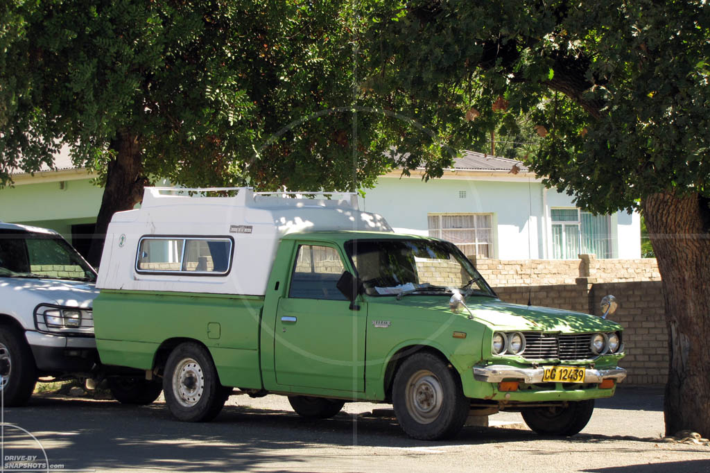 Parked under a tree in Toyota Hilux DeLuxe | Drive-by Snapshots by Sebastian Motsch (2012)